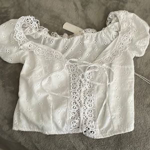 White top with tie in front